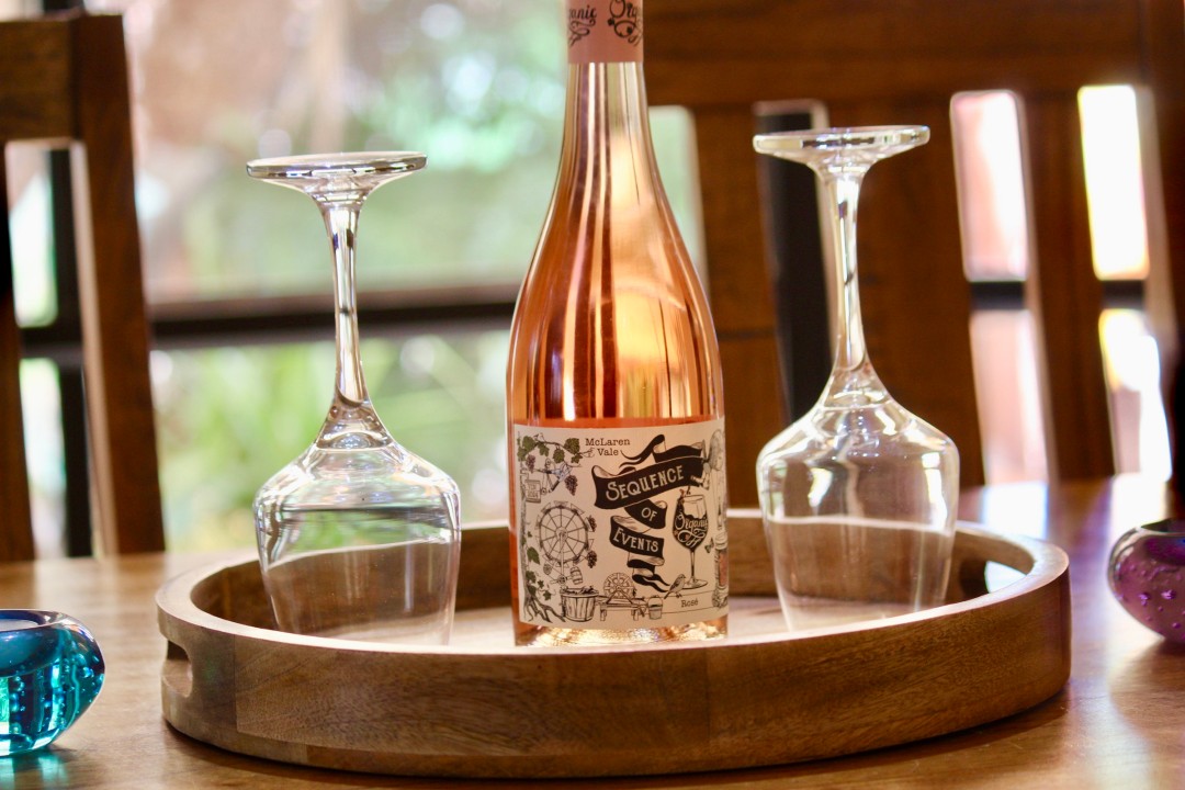 A dining area that comfortably seats six is perfect for shared meals. (Wine pictured is for styling purposes only.)