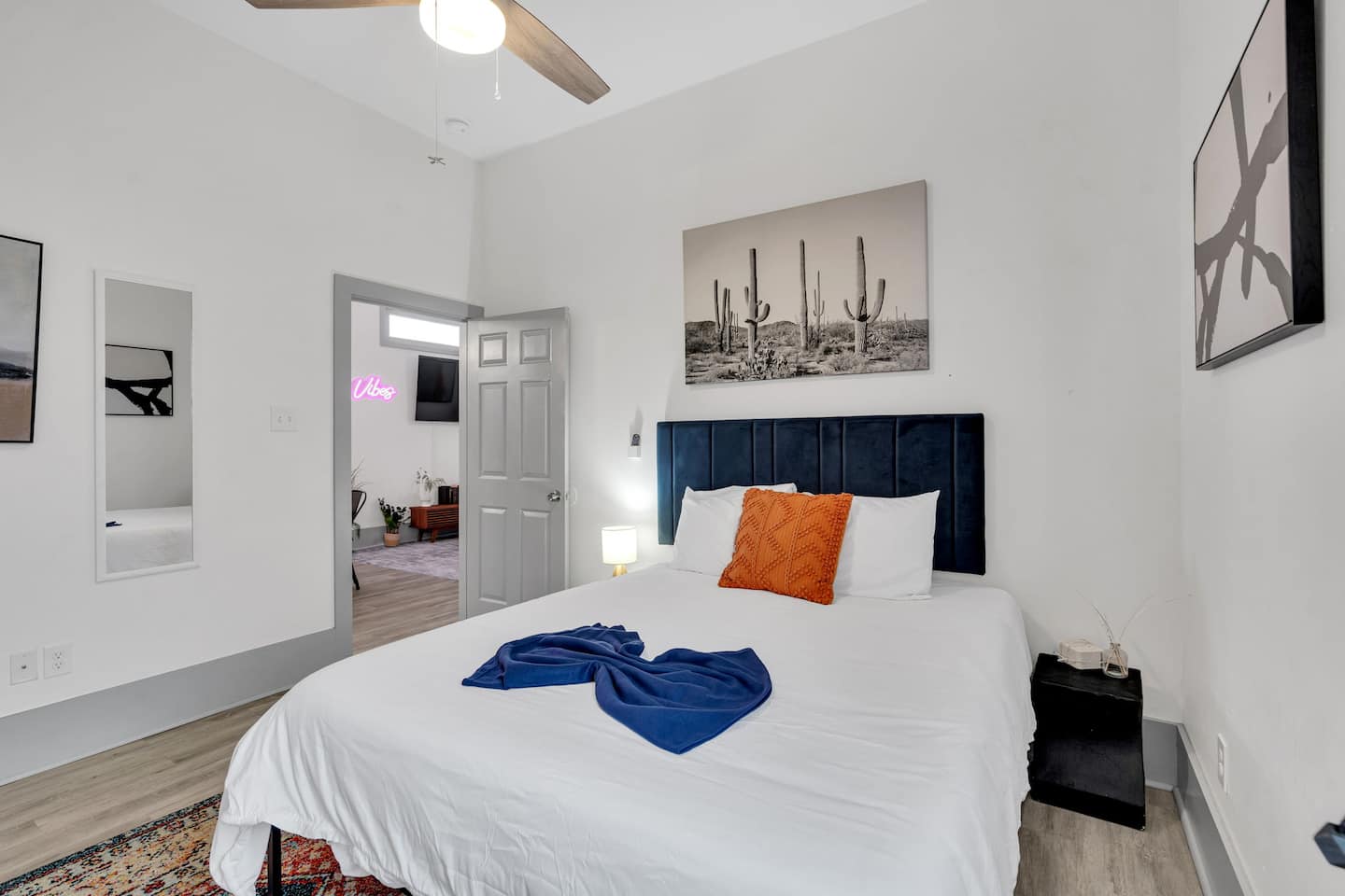 Relax in this stylish bedroom with a plush bed, warm earthy tones, and desert-inspired decor. A perfect retreat for a peaceful night’s sleep!