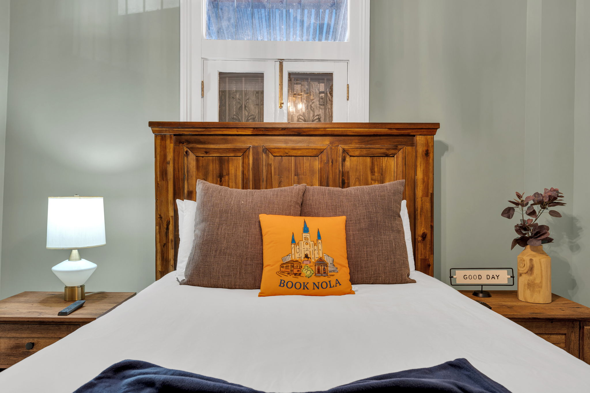 Handcrafted headboard with signature Book NOLA flair