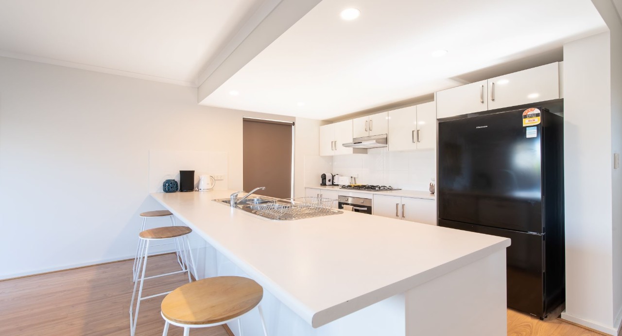 Fully equipped kitchen with Euro gas-top stove and dishwasher. New 6-seater wooden dining table for memorable shared meals.