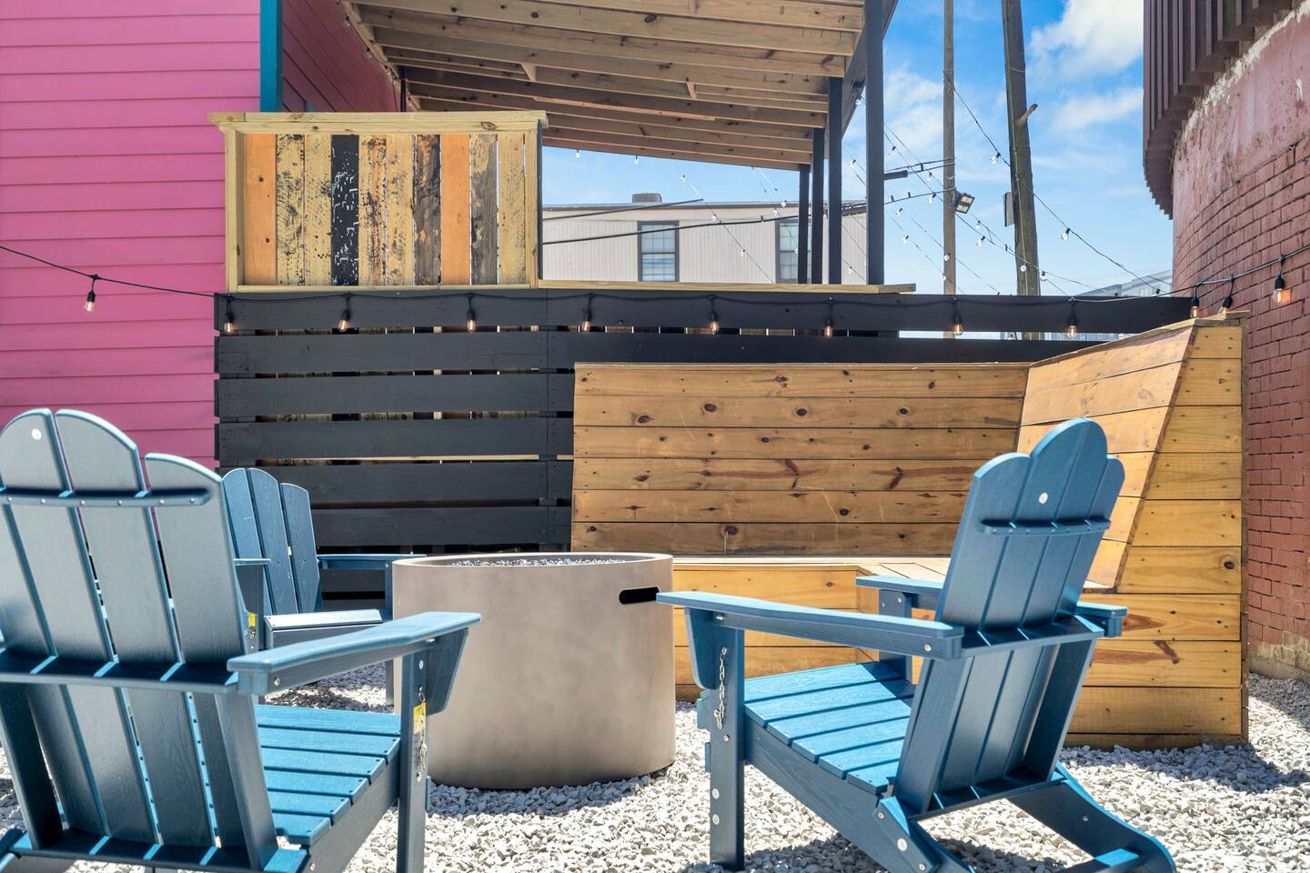 Colorful patio setup with fire pit—perfect for laid-back NOLA nights.