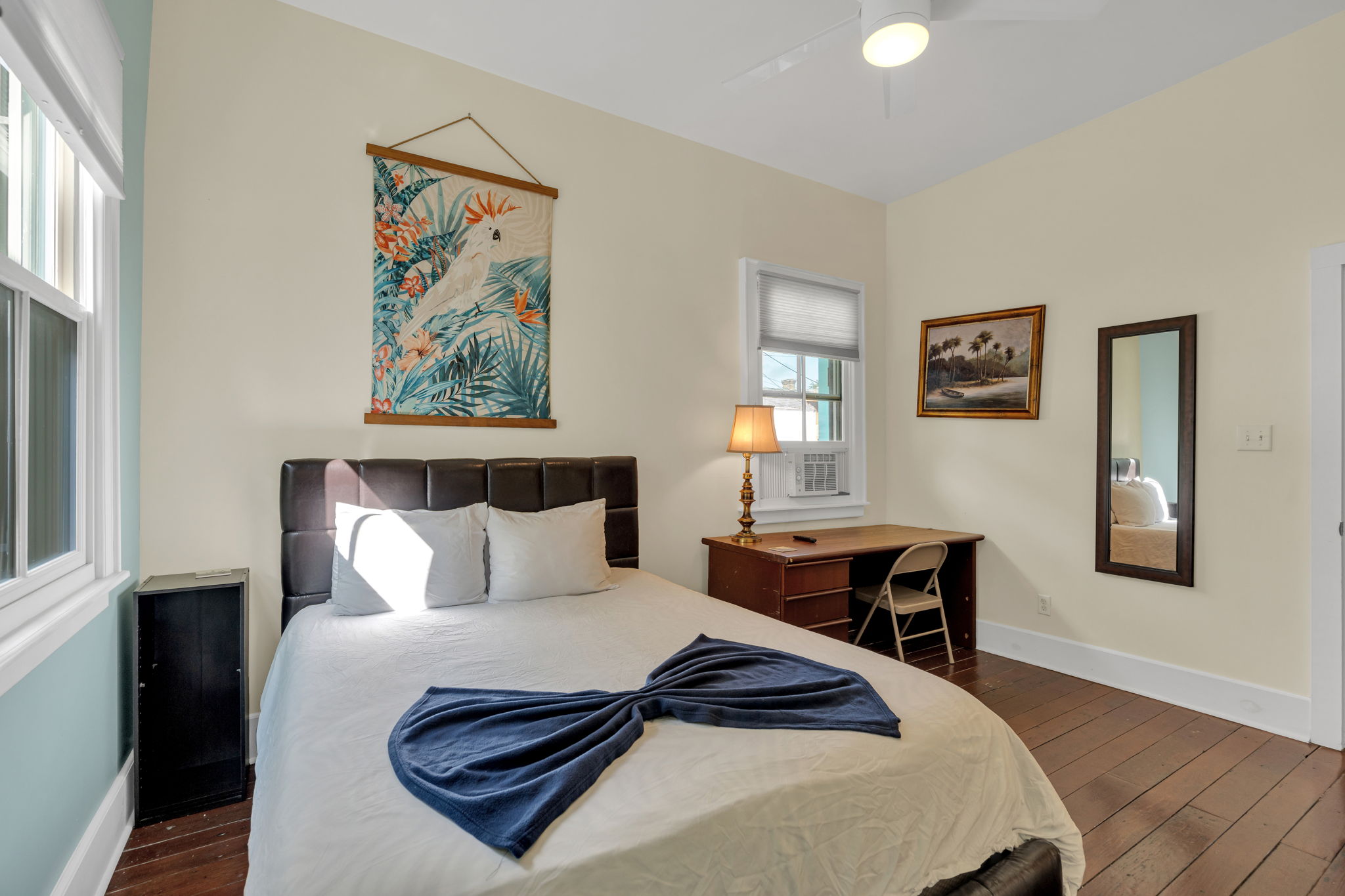 Bedroom-3: Comfortable queen bedroom with local artwork and soft linens.
