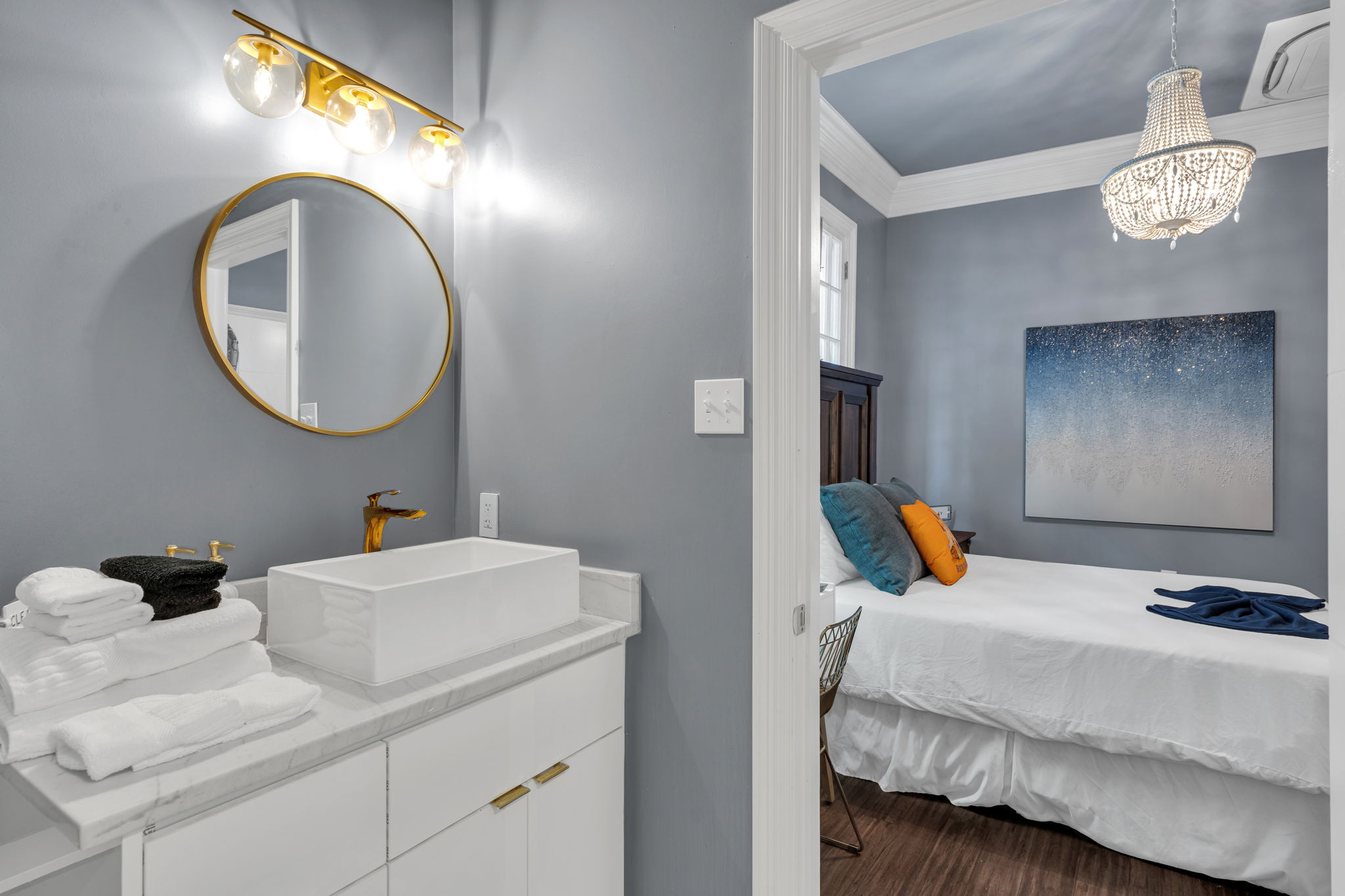 Clean, modern bath with brass accents