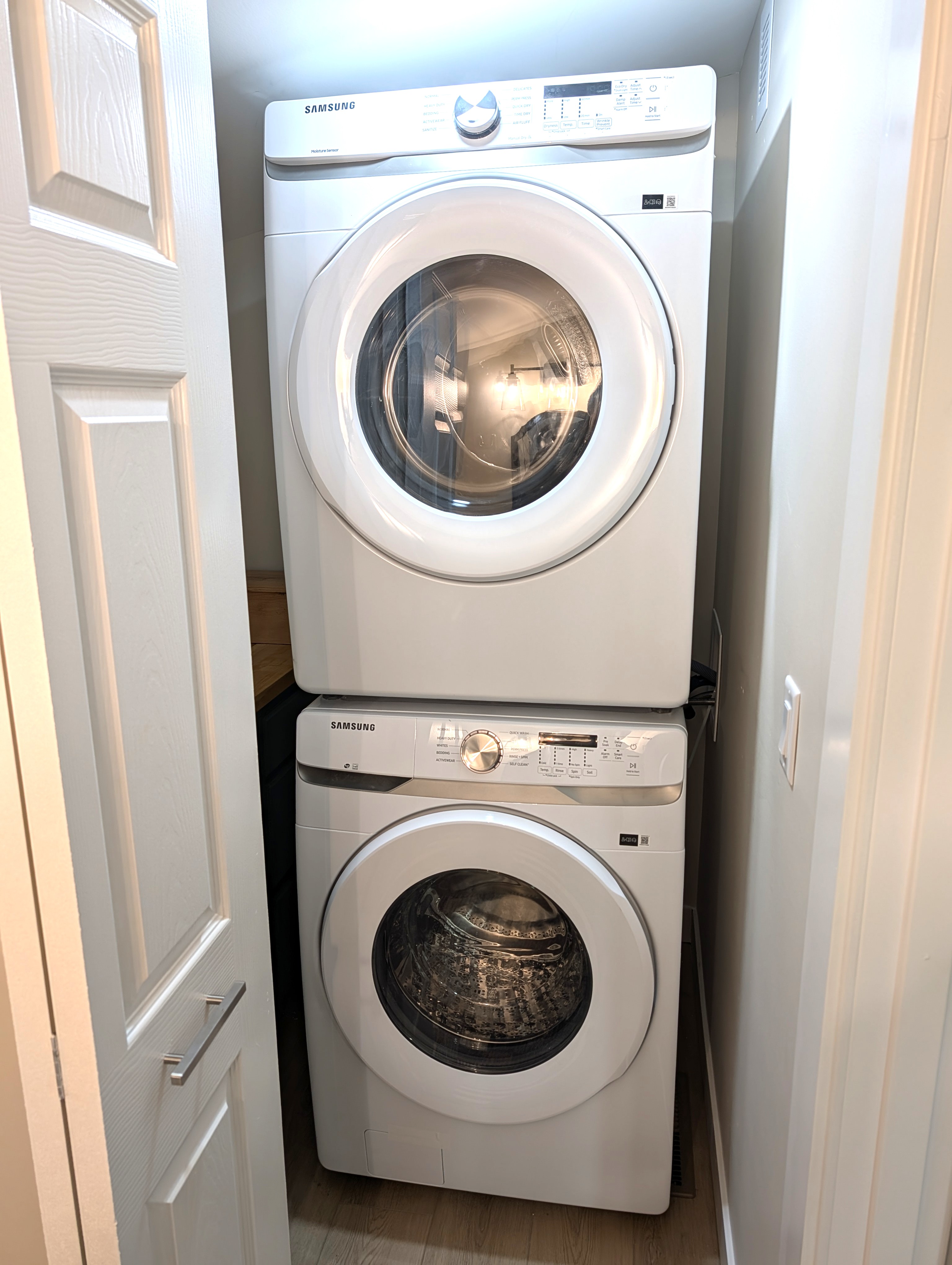 BATHROOM #2 (MAIN FLOOR):  This is a very convenient half-bathroom off of the kitchen.  It also includes a laundry closet with a stacked washer and dryer in it.