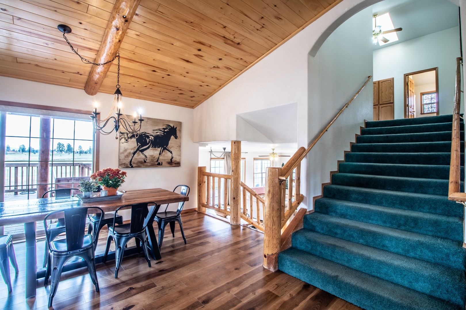 Stairway to Upper Area and Dining room Table