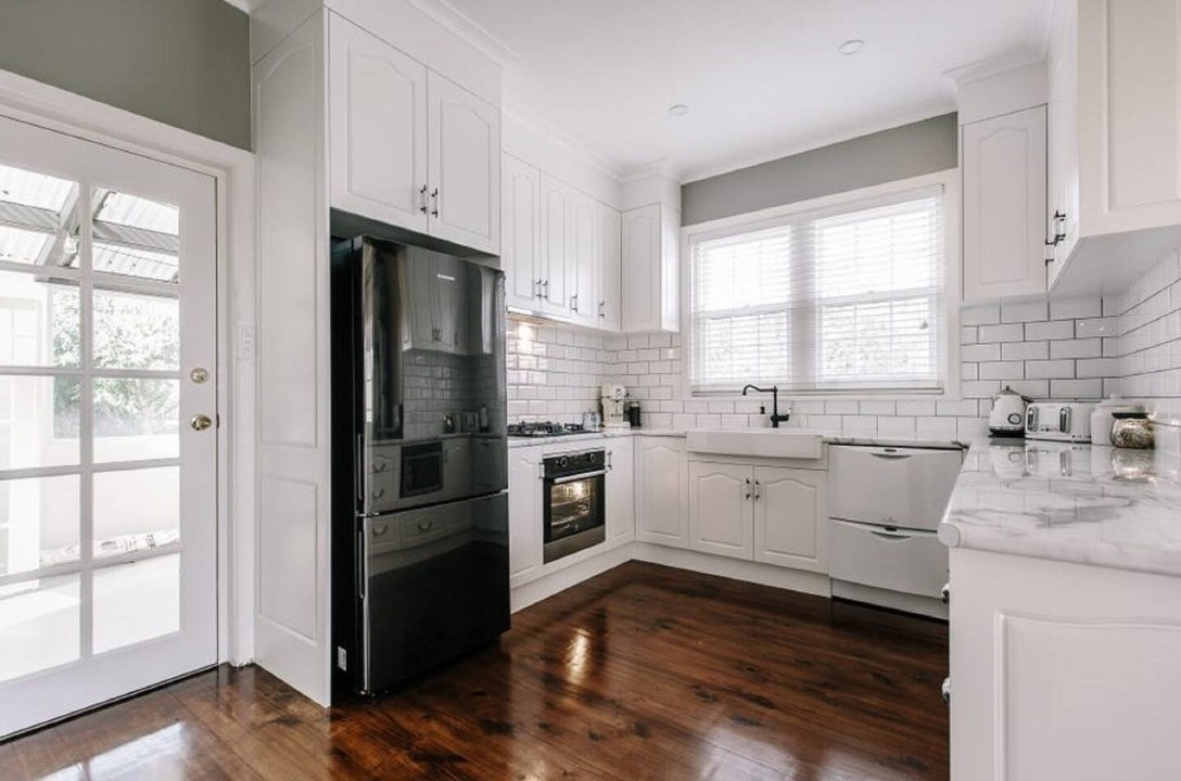 Fully equipped kitchen with gas and electric cooking, dishwasher, and full-size fridge.