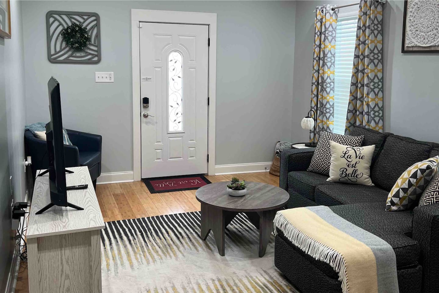 Relax in this comfortable living room space with a smart tv and electric fireplace