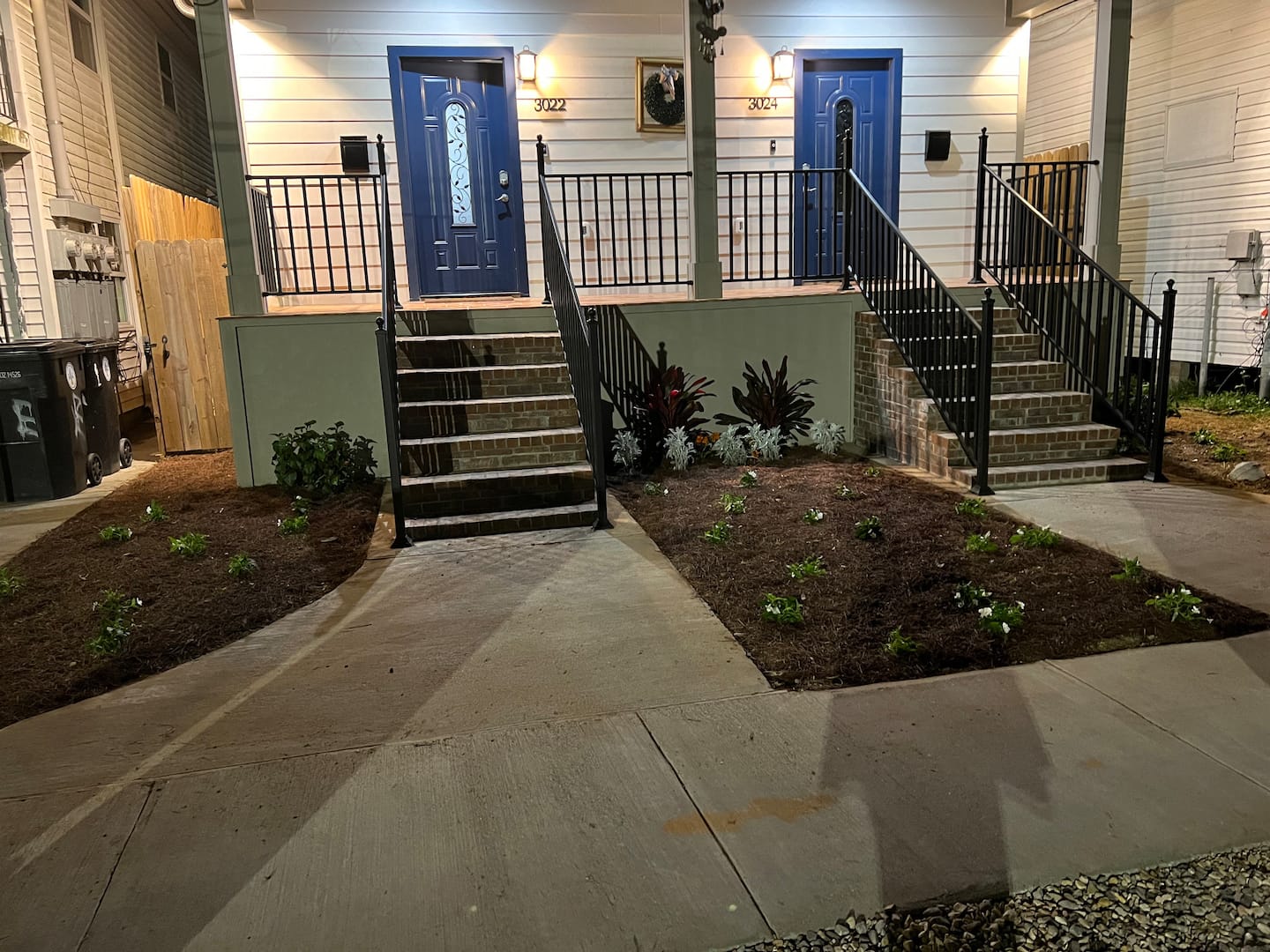 Well lit front entrance to duplex home