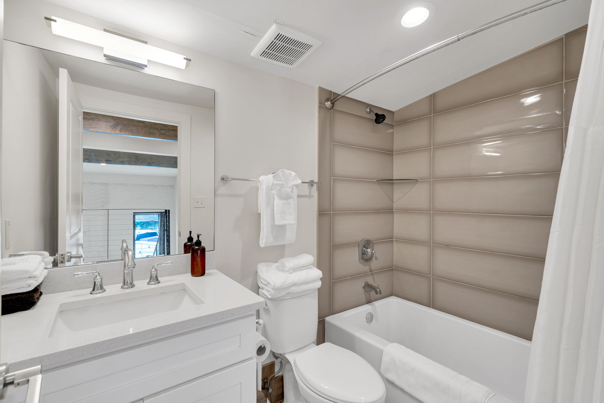 Fully stocked with fresh towels and a full tub/shower combo for relaxing soaks.