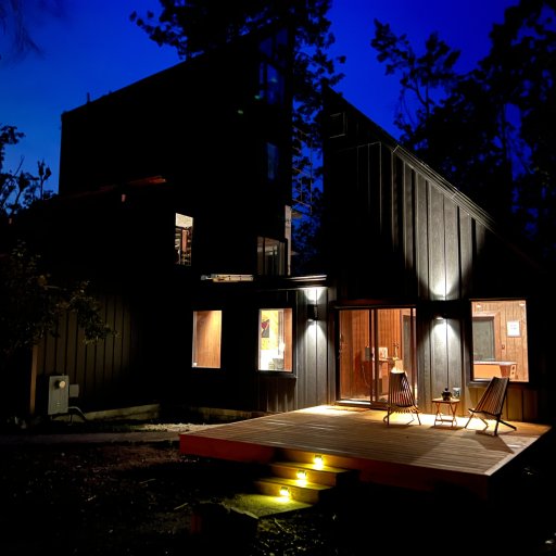 Welcoming cabin glow at dusk for your arrival