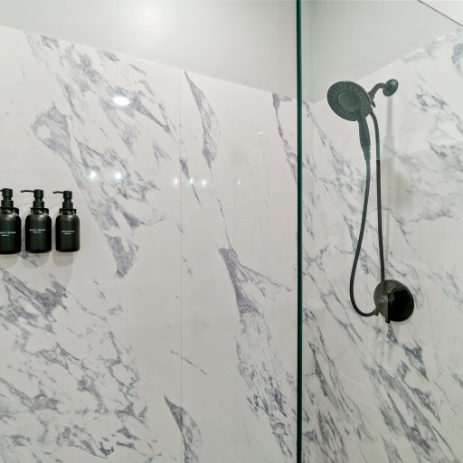 Marble-Style Walk-In Shower with Premium Bath Products