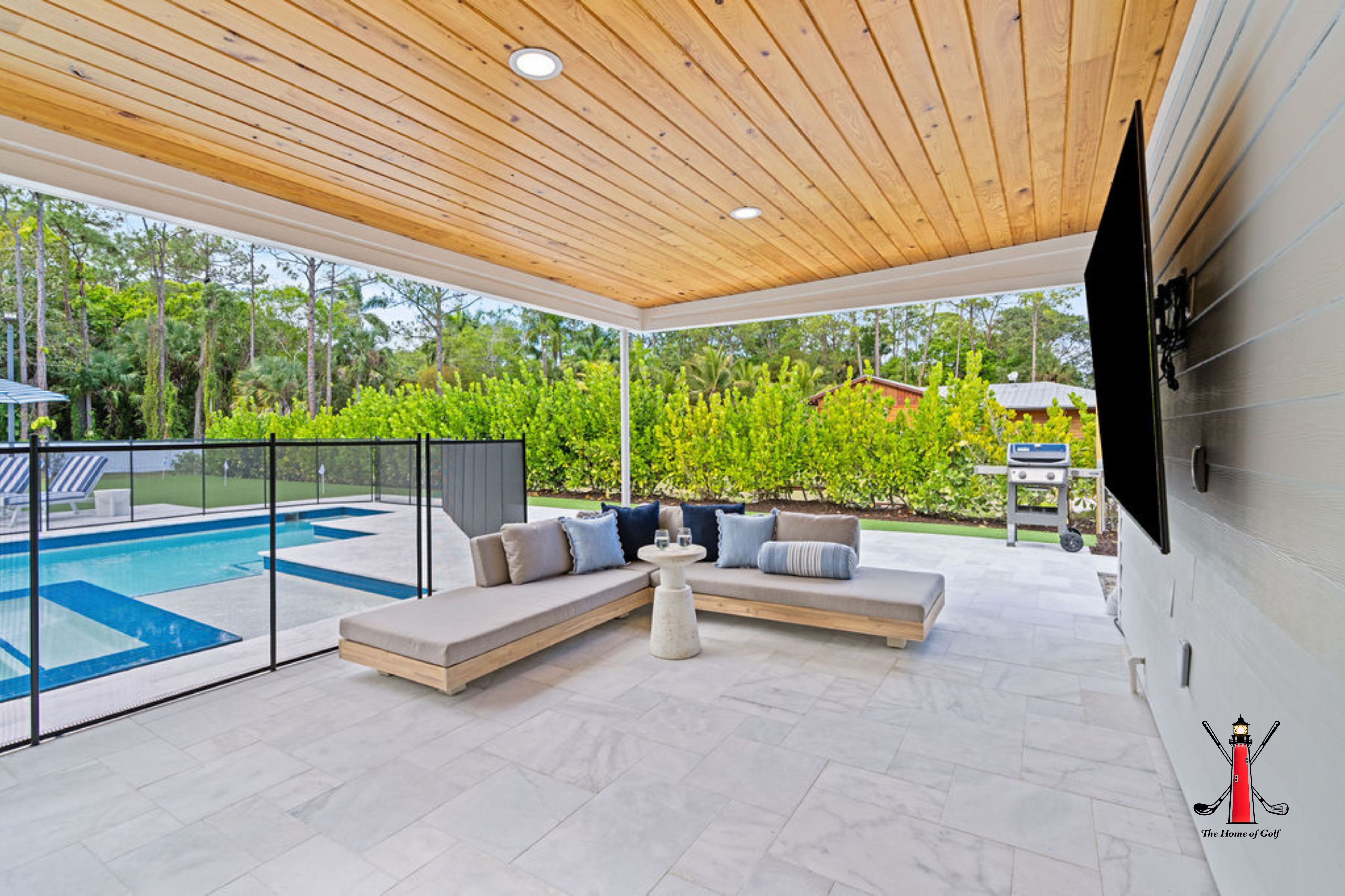 Enjoy the luxury of a spacious double vanity with marble countertops and bright, elegant lighting.