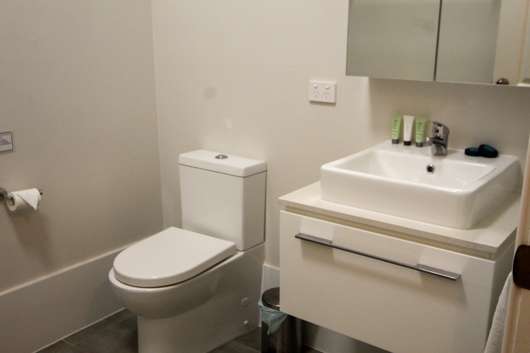 Open plan lounge, dining, and kitchen areas with smart TV, free WiFi, split system air conditioning, modern kitchens, and refurbished bathrooms in each unit featuring contemporary fixtures for guest comfort.