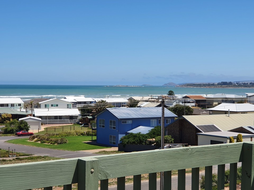 Upper-level deck with sweeping views ideal for sunrise coffees, sunset drinks, and alfresco lounging