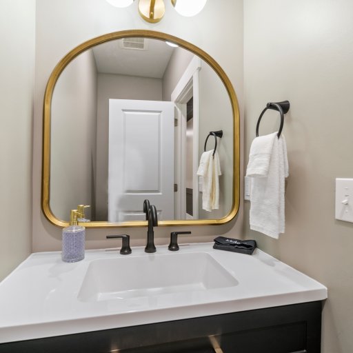Third Bathroom – Half Bath with Modern Fixtures Near Living Area