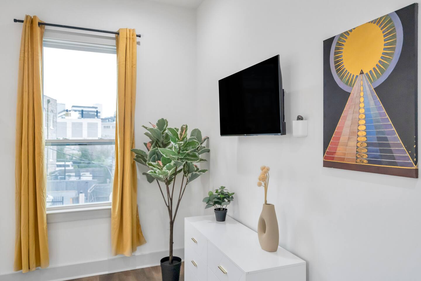 Spacious third bedroom with king size bed, ample natural light, and views of the superdome