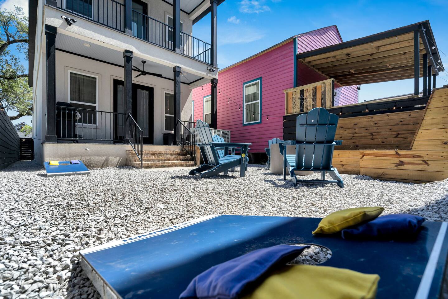 Backyard fun with cornhole, fire pit, and a splash of NOLA color.