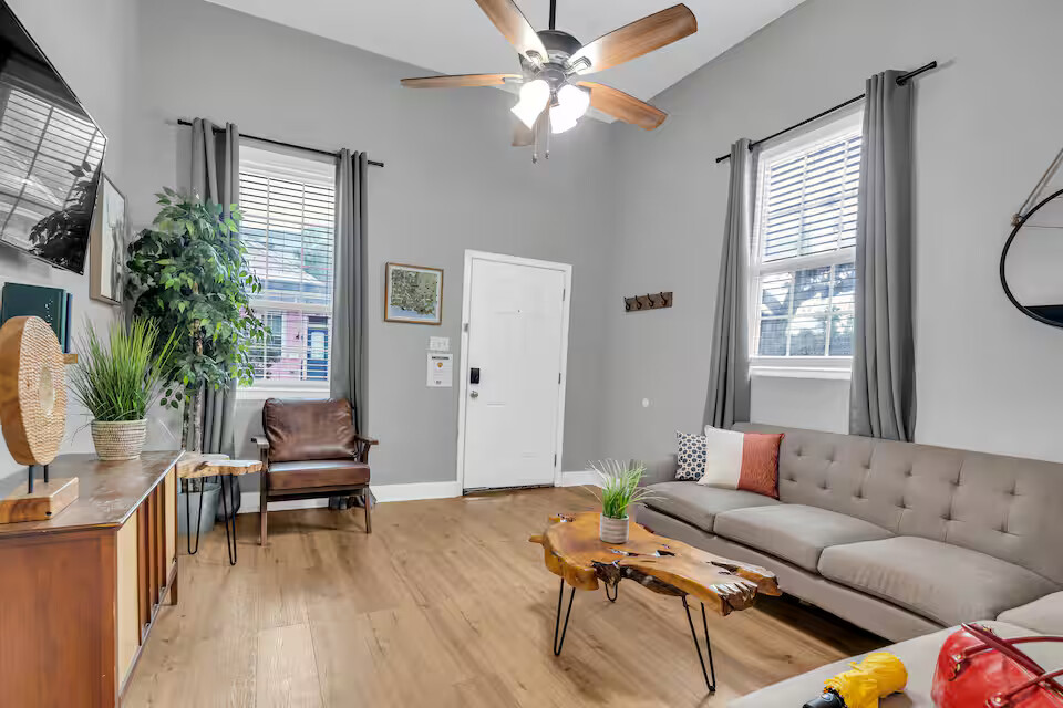 The living room is spacious and inviting, with cozy seating and plenty of natural light. It’s the perfect spot to relax, stream your favorite shows, or gather for good conversation.