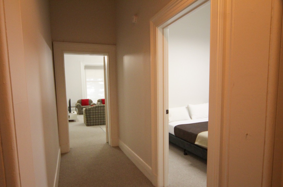 Features open-plan living and dining, a well-equipped kitchen, smart TV, split-system air conditioning, and a sleek, modern bathroom—designed for comfort and convenience.