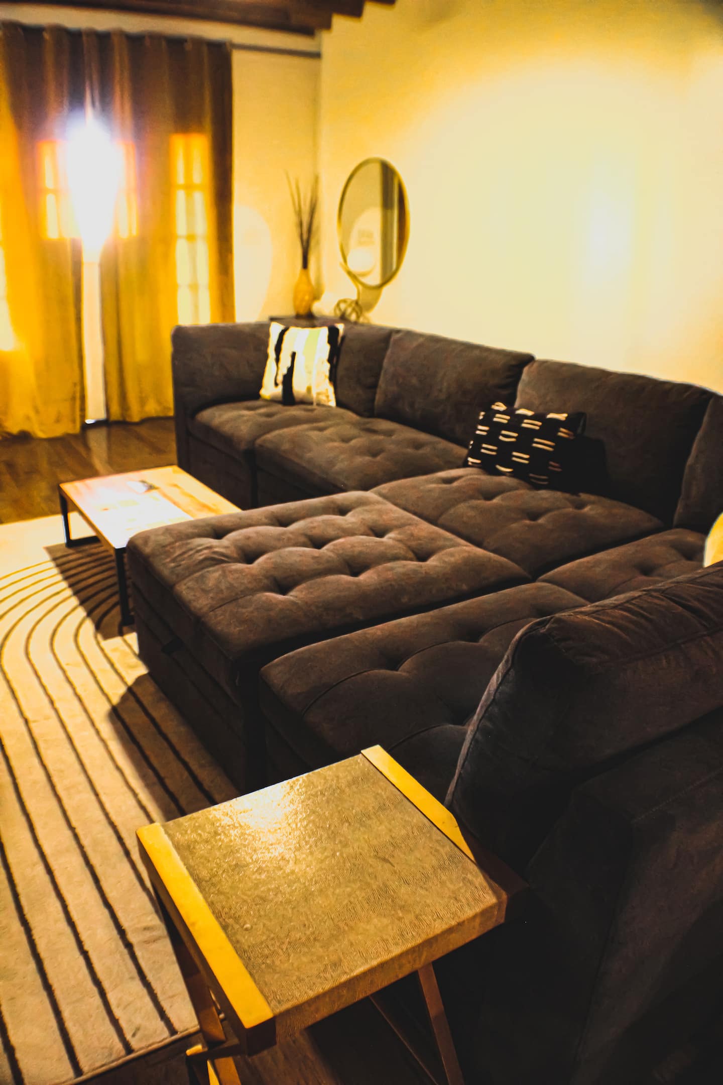 Cozy lounge vibes with plush seating and warm New Orleans style.