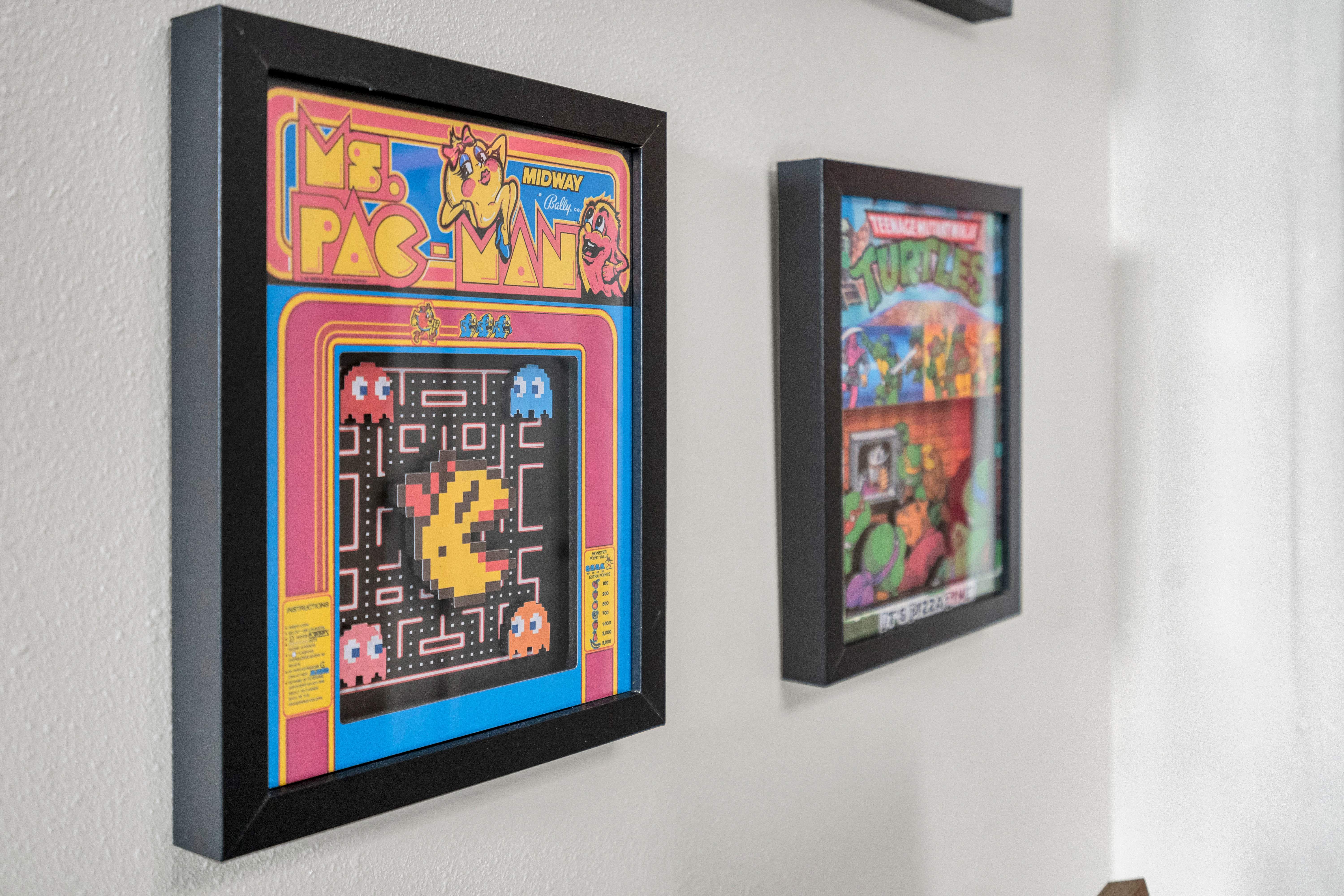 Retro-inspired wall art brings colour and character to the space.