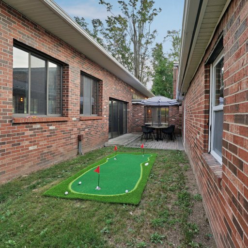 Private putting green for casual practice and friendly competition.
