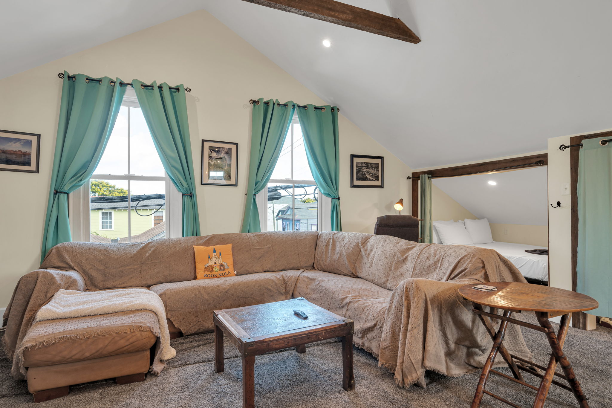 Spacious loft lounge with sectional sofa and entertainment area.