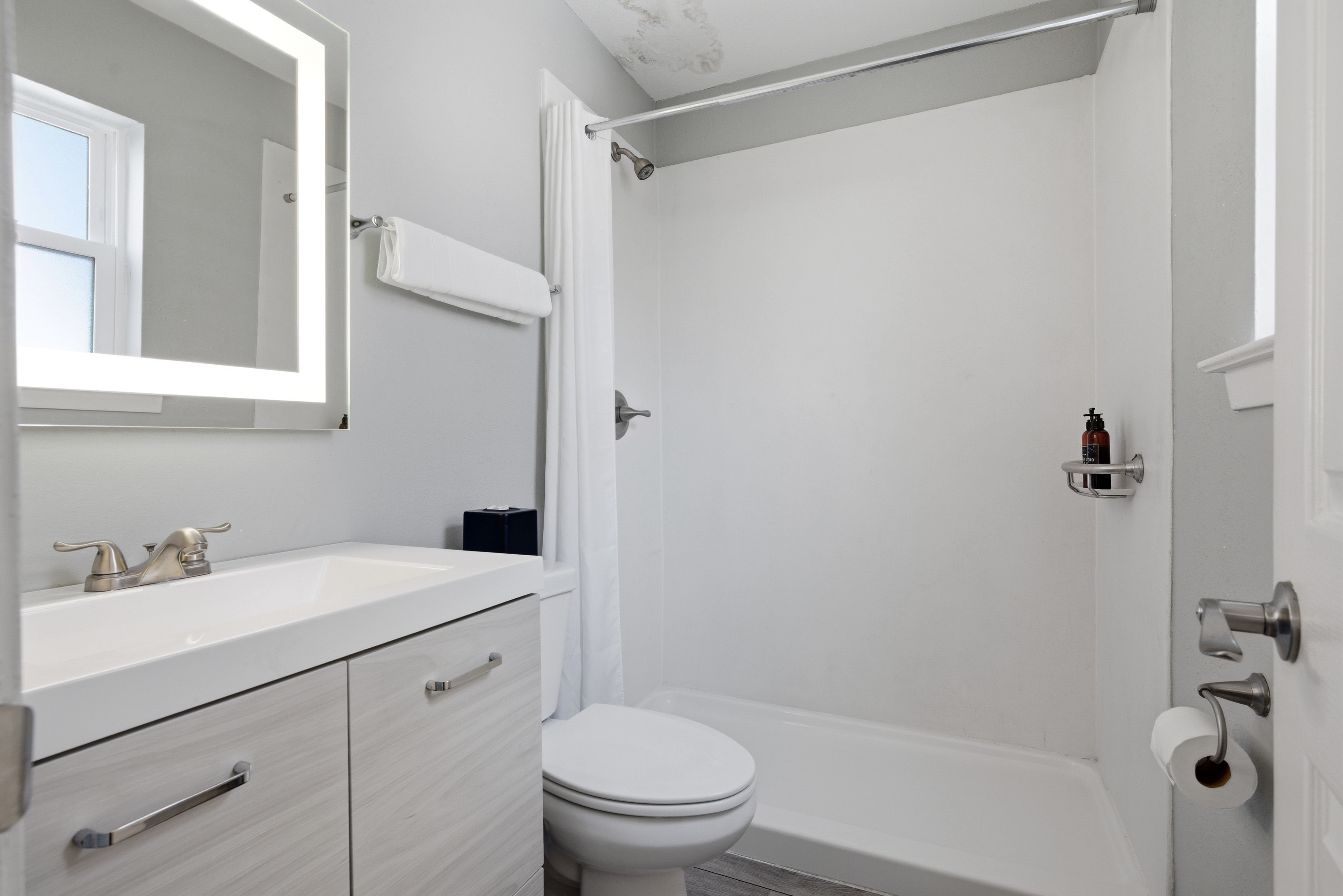 Fresh bathroom space stocked with essentials to refresh & unwind