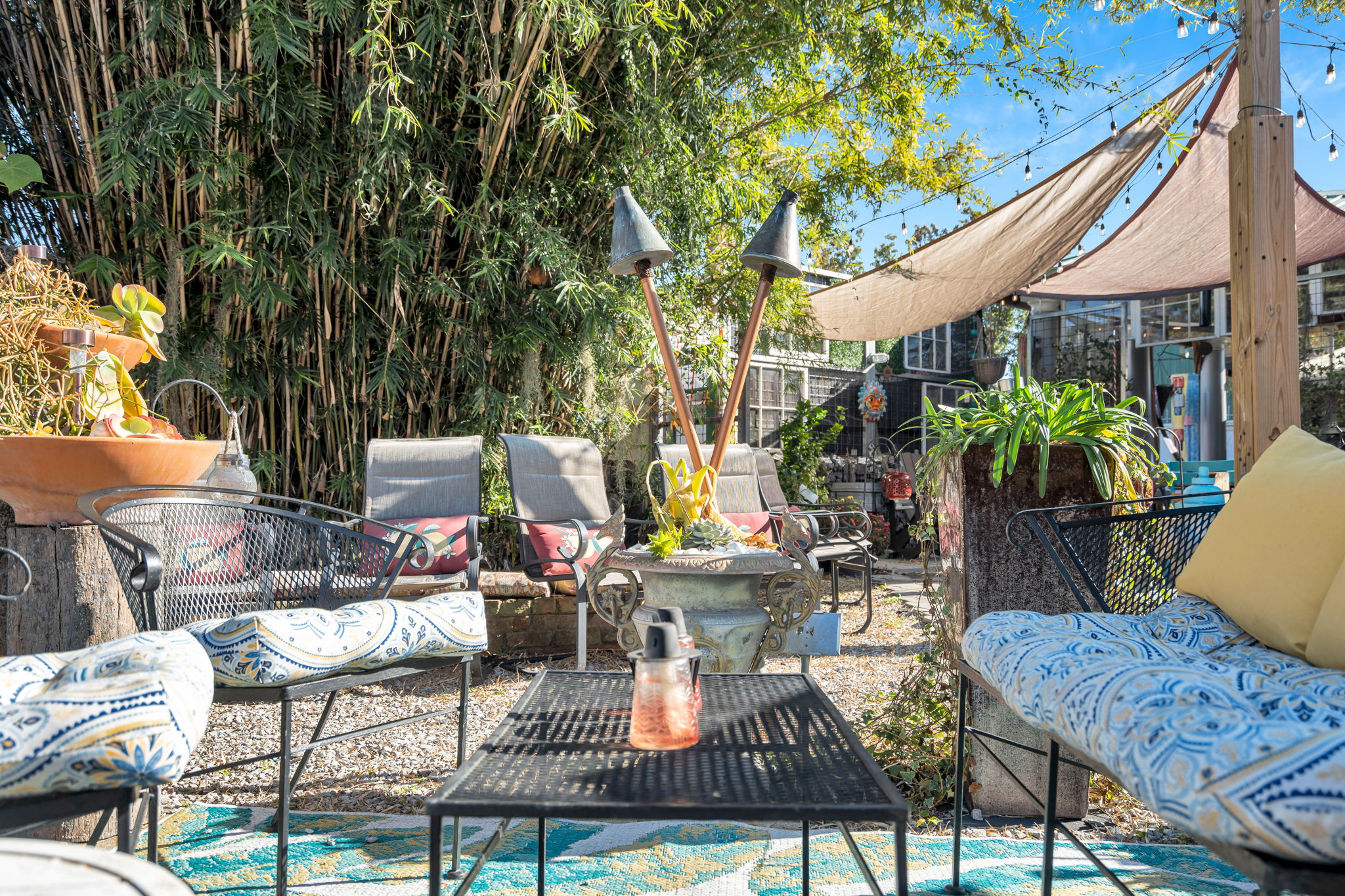 Relaxed outdoor lounge surrounded by greenery