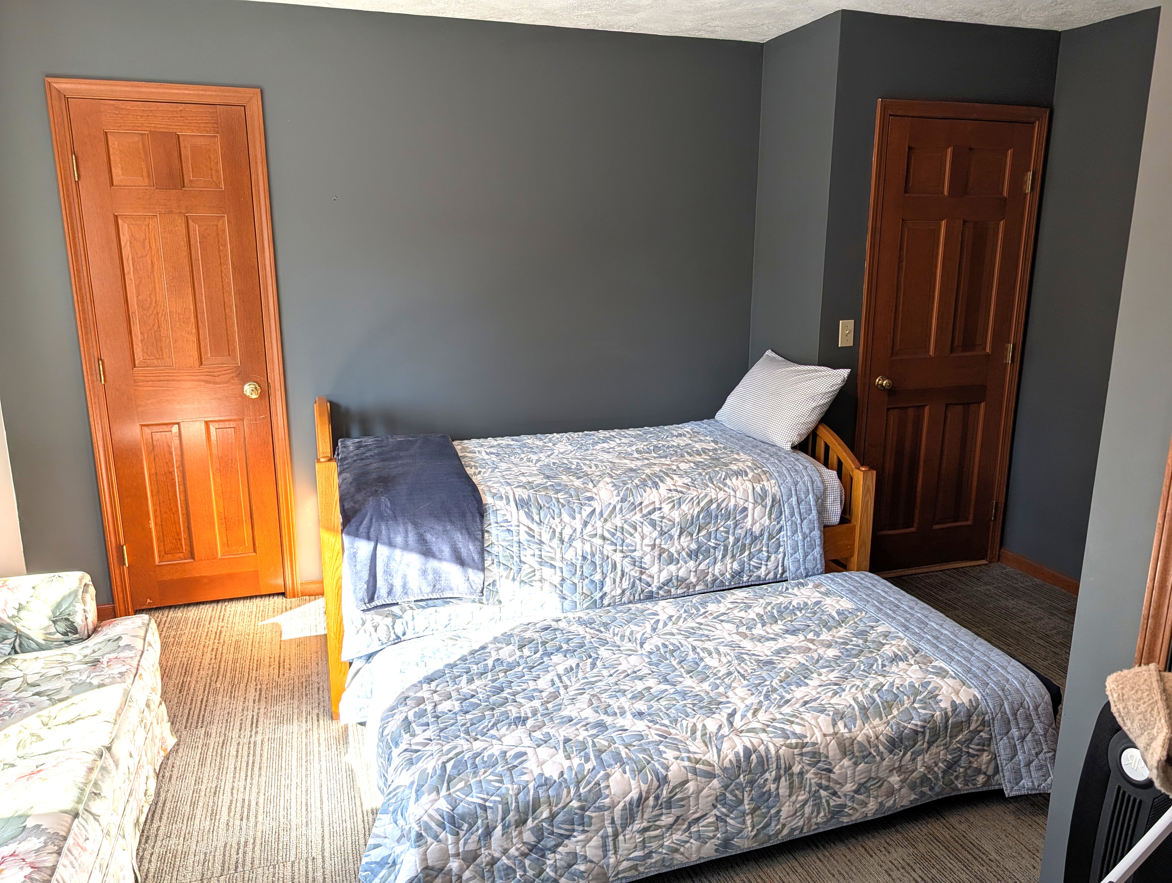BEDROOM #5 (SECOND FLOOR):  Mixed-use bedroom on the second floor with a trundle bed, loveseat, and a washer and dryer.