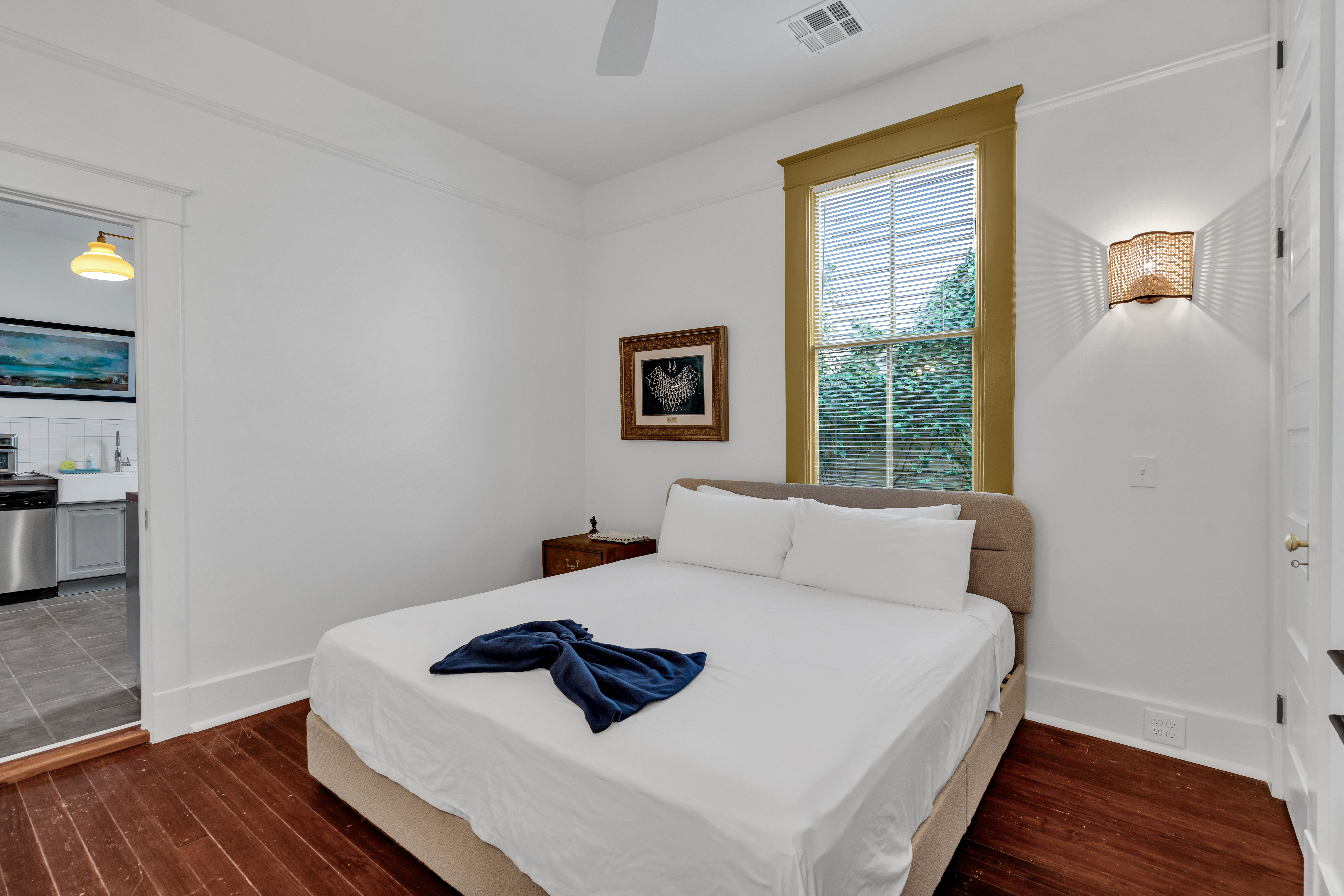 Bedroom with window light and clean linens