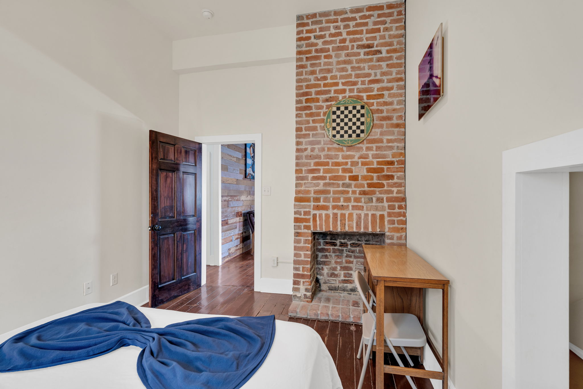 Original brick fireplace adds a warm, historic touch.