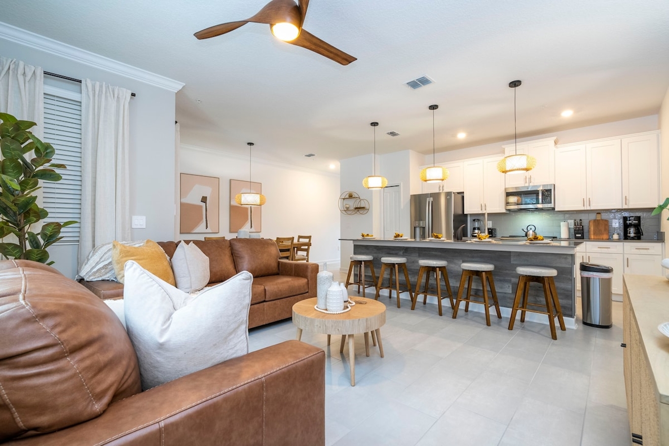 Open living space that seamlessly connects the beautiful kitchen and dining area, offering a perfect blend of comfort and style.