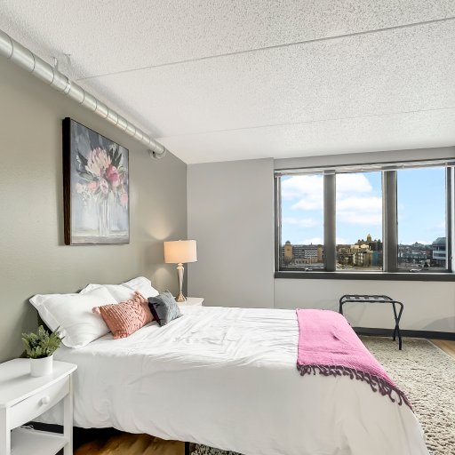 Plush queen bed to unwind after a night on the town