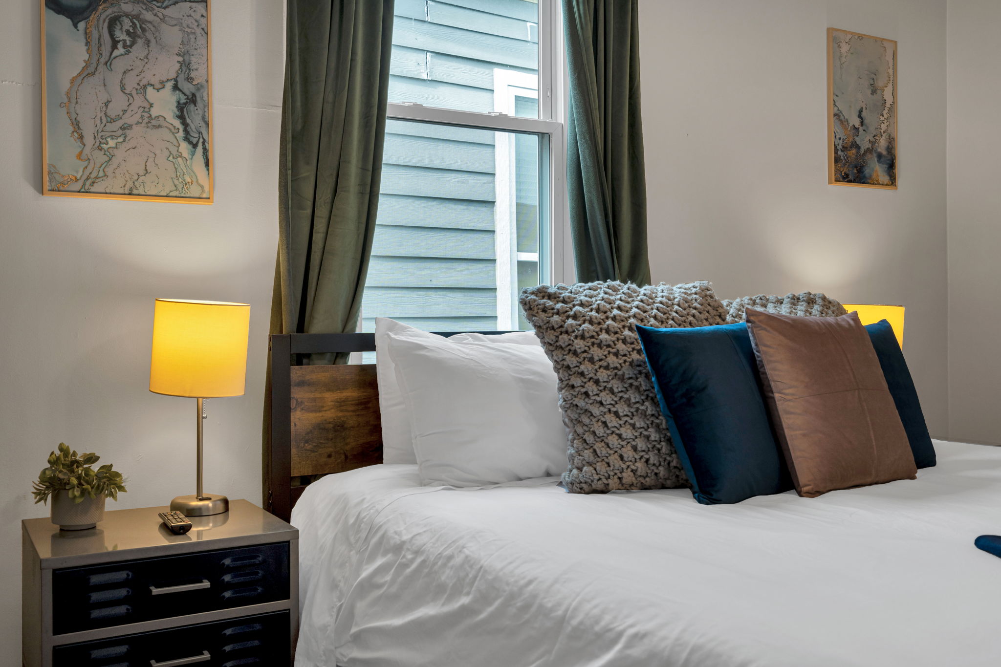 Plush bed with cozy layered pillows