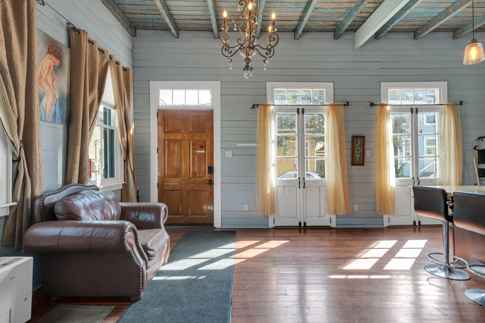Welcoming entry filled with natural light and classic wood accents.