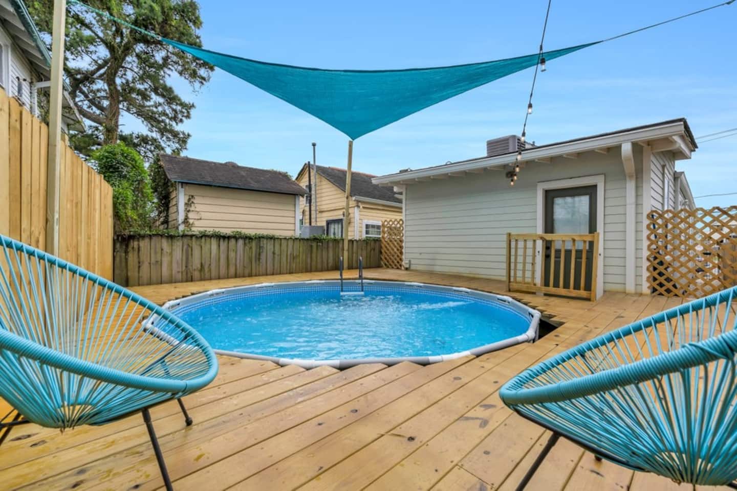 Above ground pool in backyard