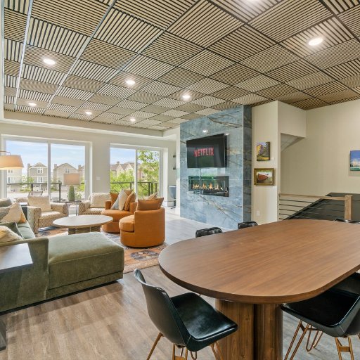 Living Room: Modern elegance with a fireplace, large windows, and space for memorable gatherings!