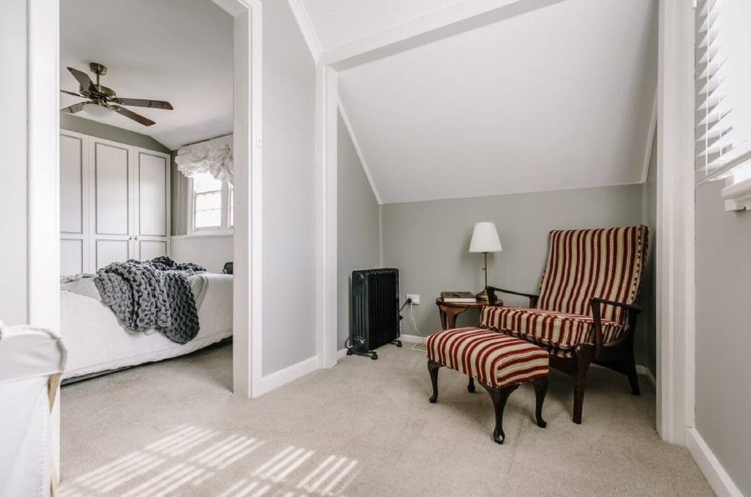 Unique hidden attic reading nook and quaint cellar for added character.
