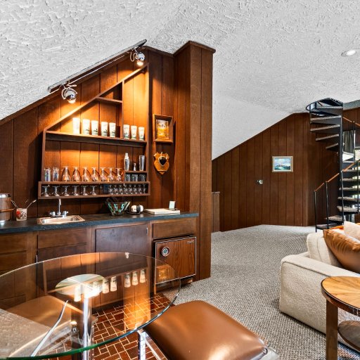 Wet bar and lounge seating in the cinema room