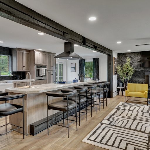 Spacious chef’s kitchen with oversized island and seating for the group.