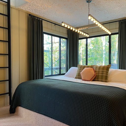 Hole in One master suite with king bed and forest views