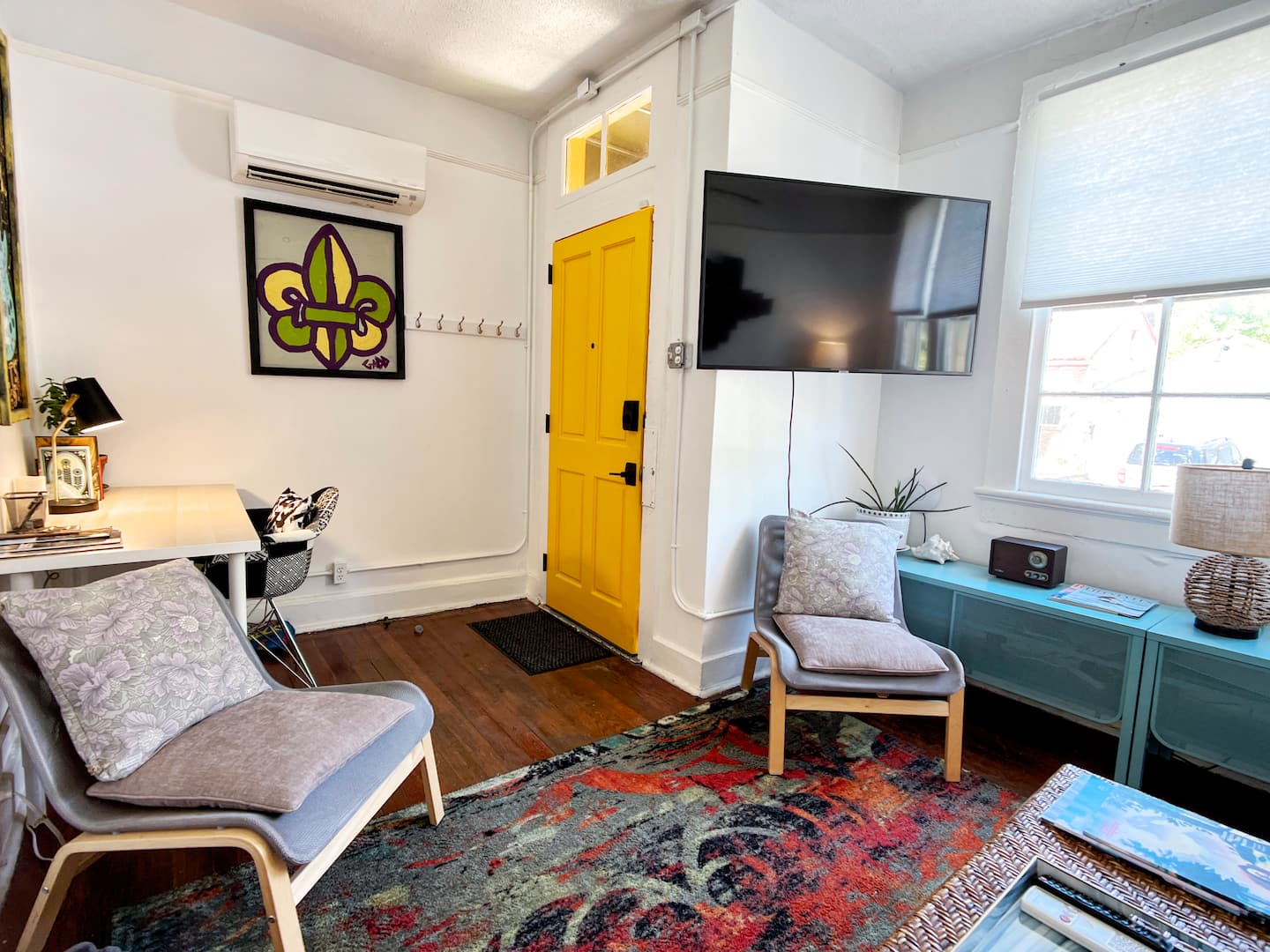 Charming living room with vibrant decor and cozy ambiance.