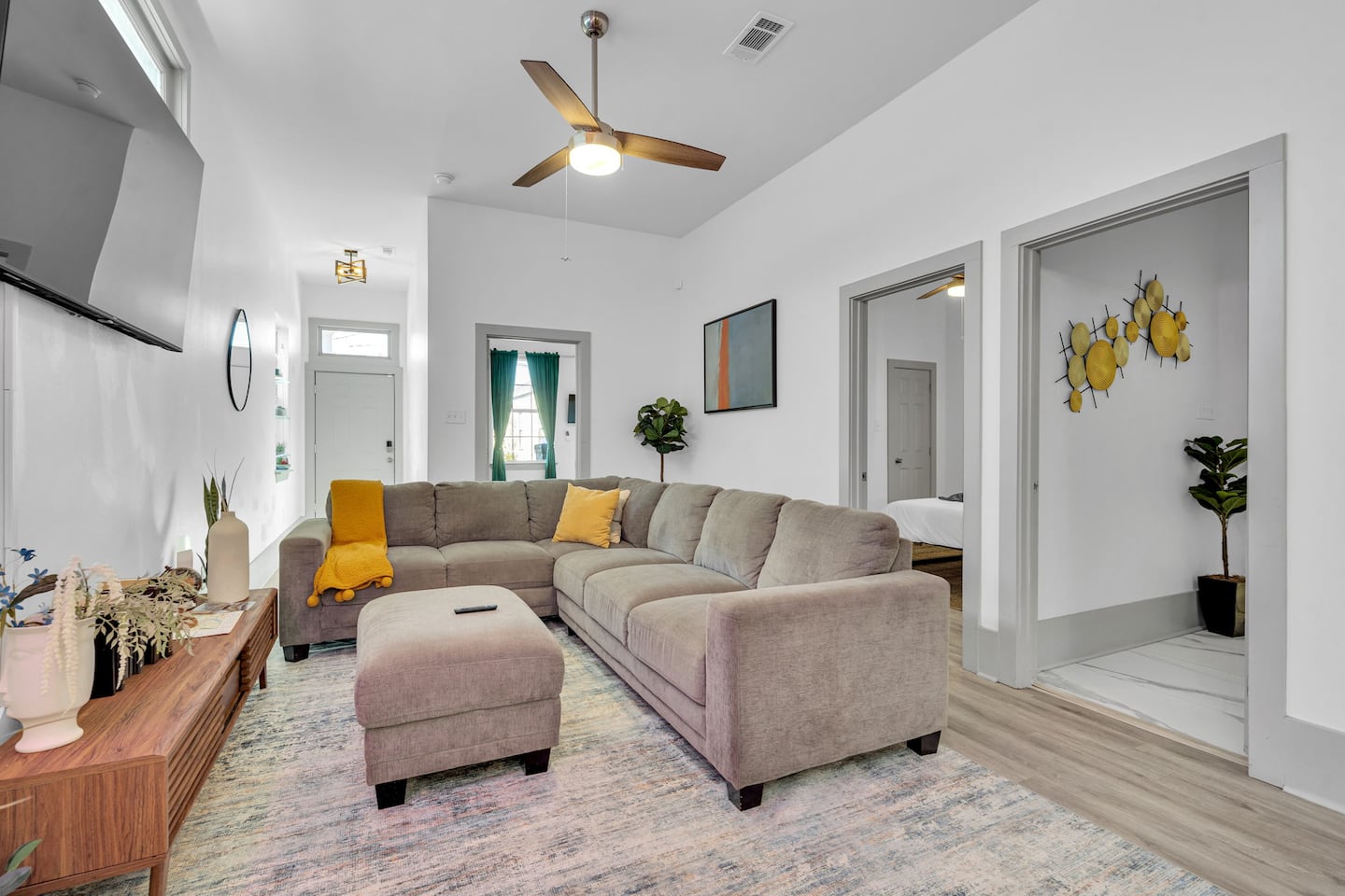 Relax in style! This beautifully designed living space features modern decor, a cozy sectional, and plenty of natural light—perfect for unwinding after a day exploring New Orleans. Your ideal getaway starts here!