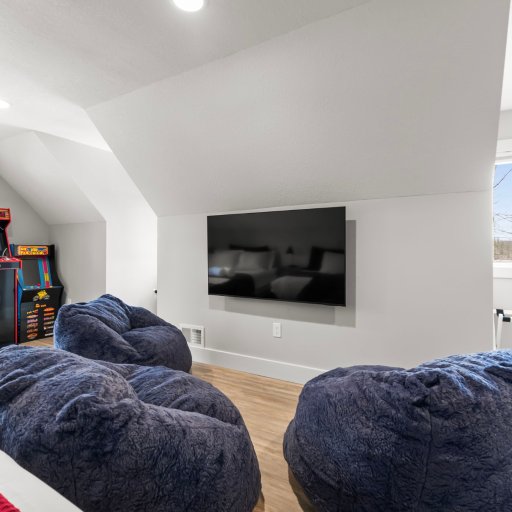 The Crew Room lounge — bean bag chairs, big screen, and arcades