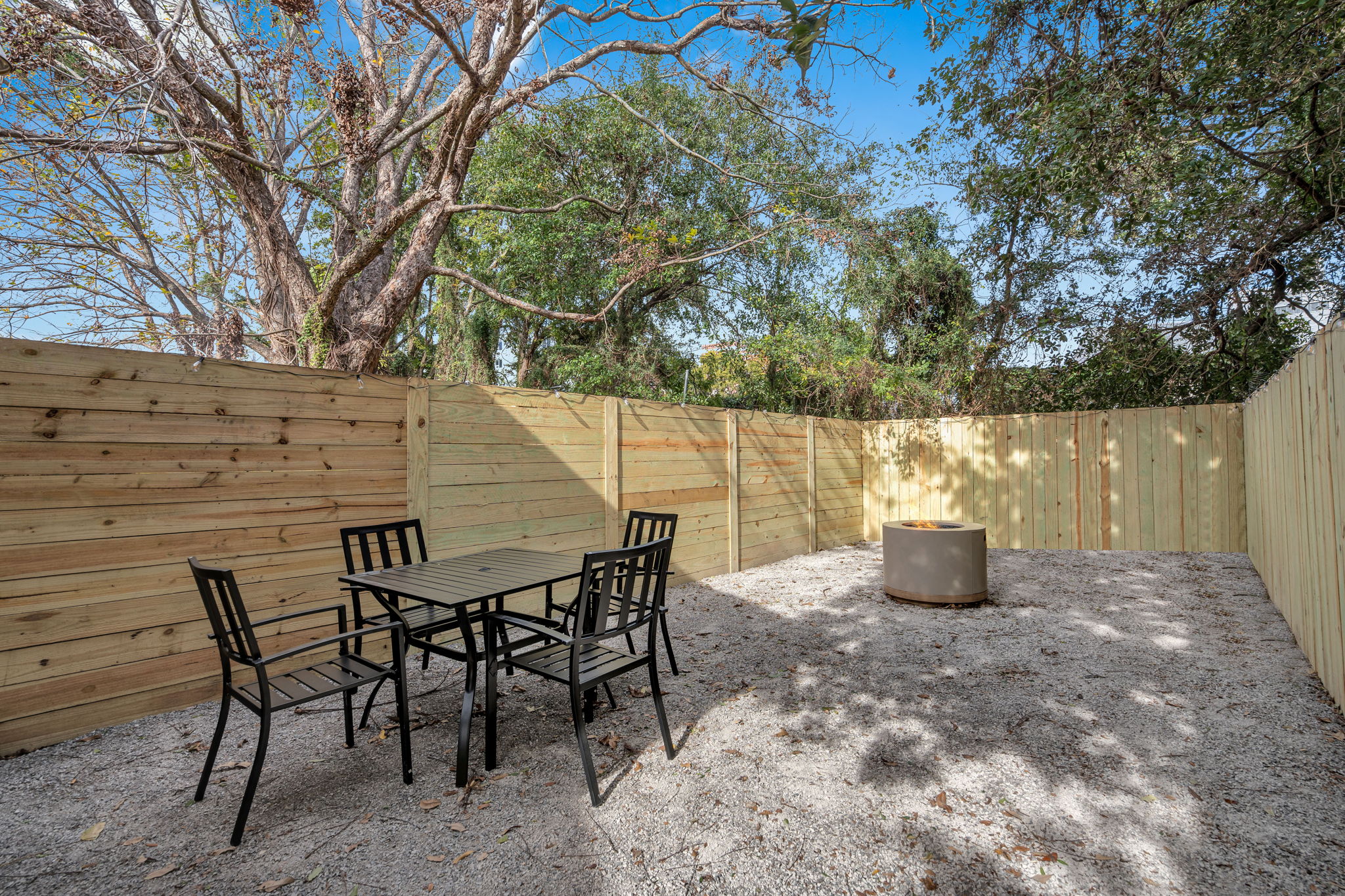 Outdoor dining space under the trees