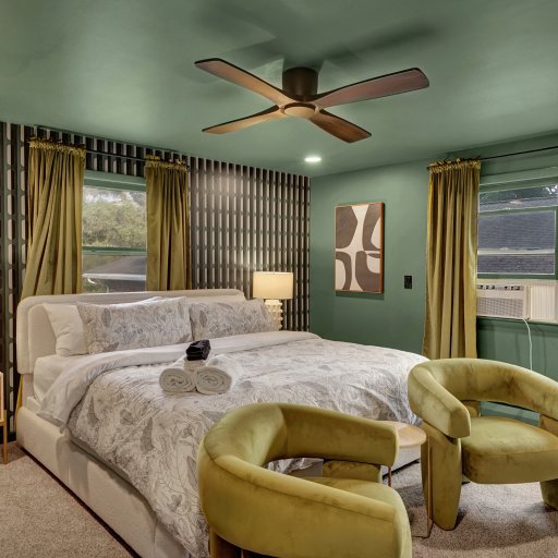 Primary suite with king bed and calming, spacious layout.