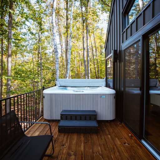 Private hot tub surrounded by trees — perfect for stargazing