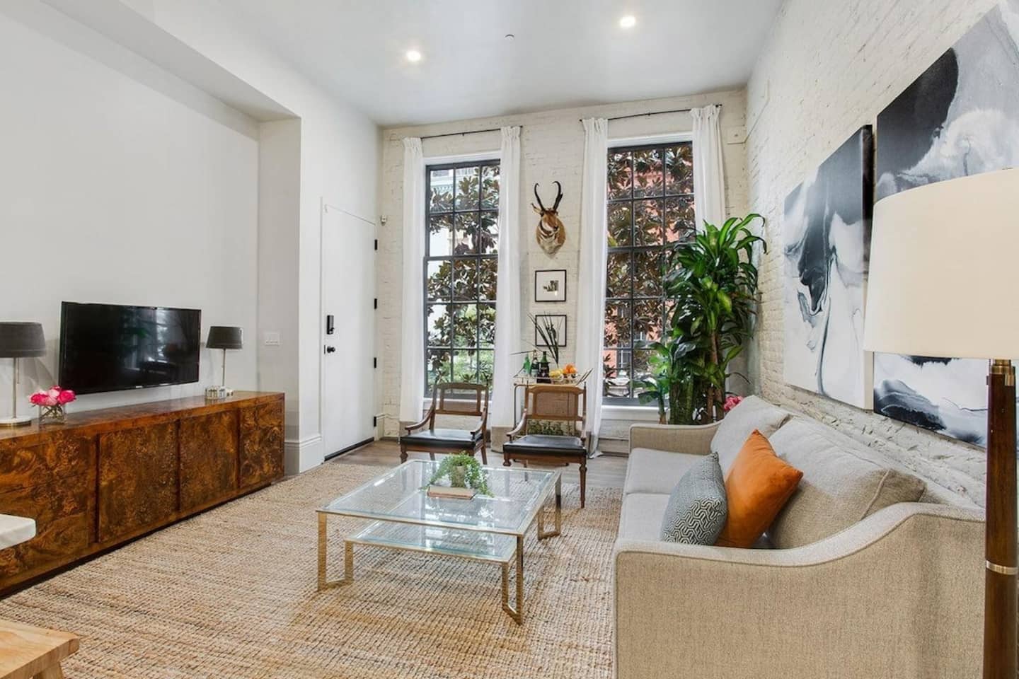 Beautiful living room space equipped with TV perfect for viewing Netflix