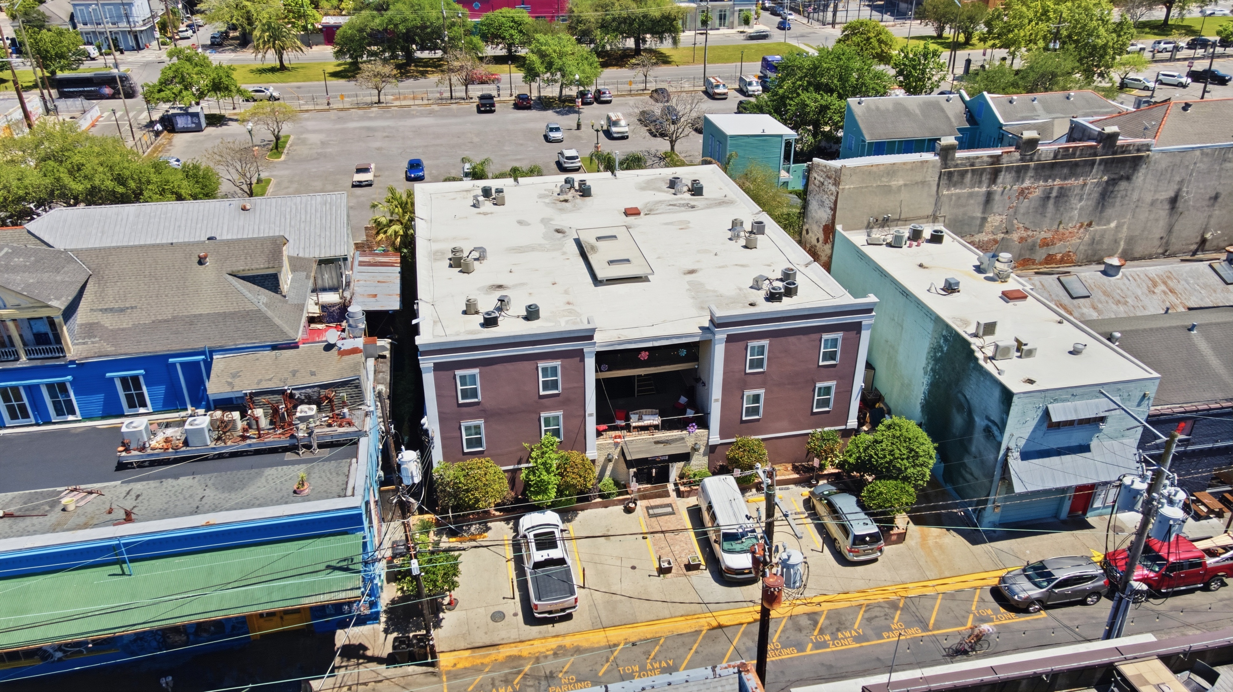 Skyline glimpses beyond historic rooftops